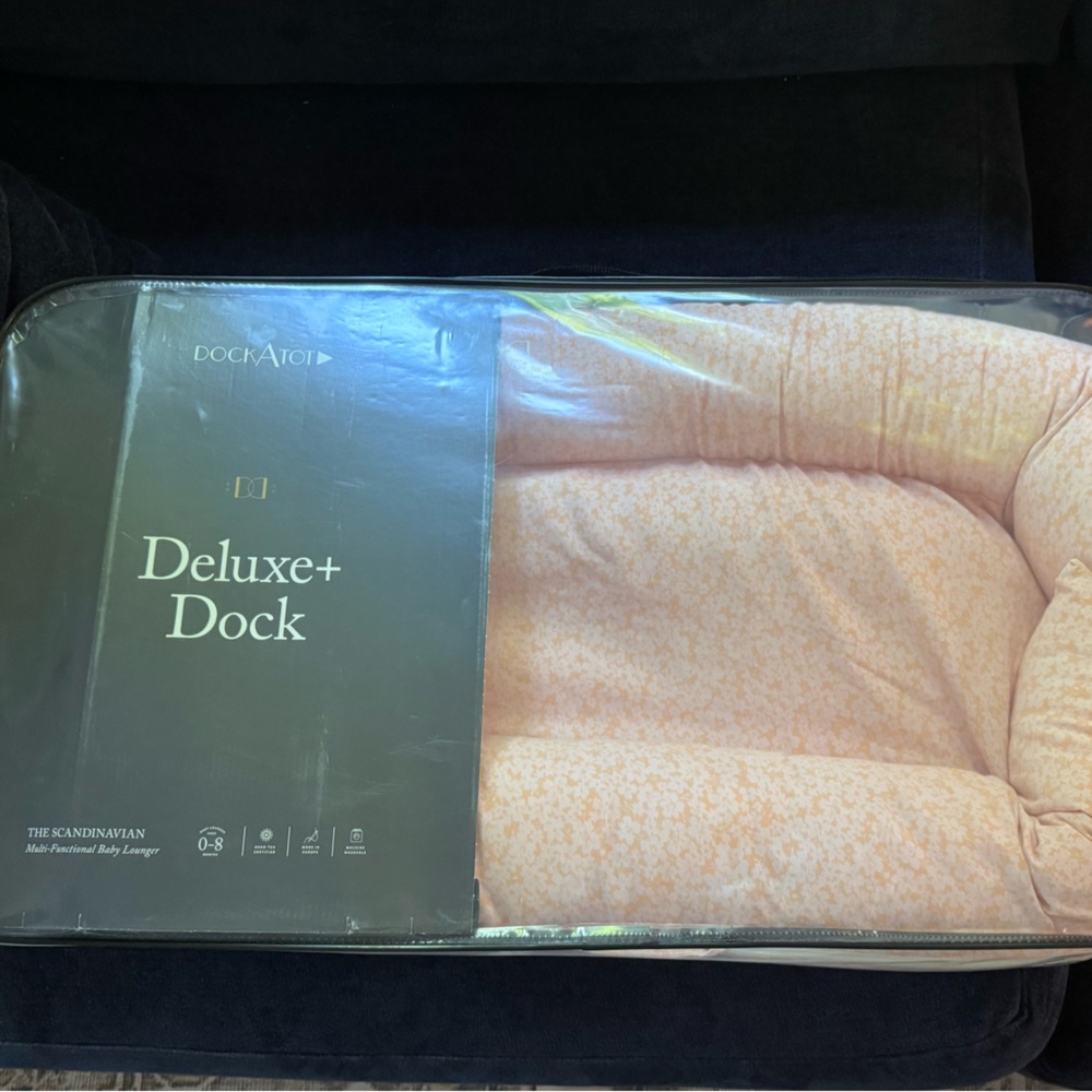 Dockatot Deluxe + Dock with pink and blue covers